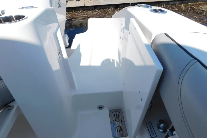  Yacht Photos Pics 2024 Pursuit DC 326 Dual Console boat interior with seating and storage area.