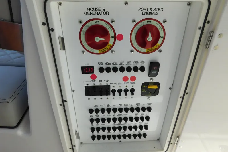  Yacht Photos Pics Control panel of 2024 Pursuit DC 326 Dual Console boat, featuring switches and gauges.