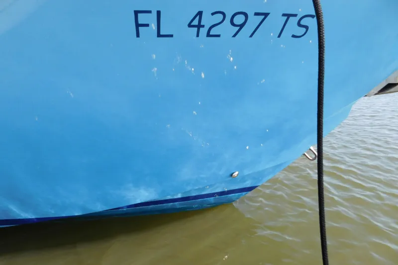  Yacht Photos Pics 2024 Pursuit DC 326 Dual Console boat with registration FL 4297 TS on water.