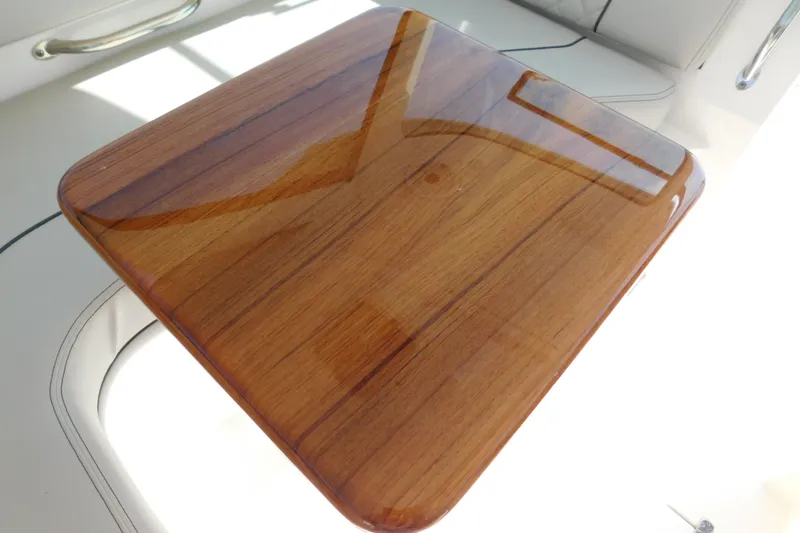  Yacht Photos Pics Polished wooden table on 2024 Pursuit DC 326 Dual Console boat.