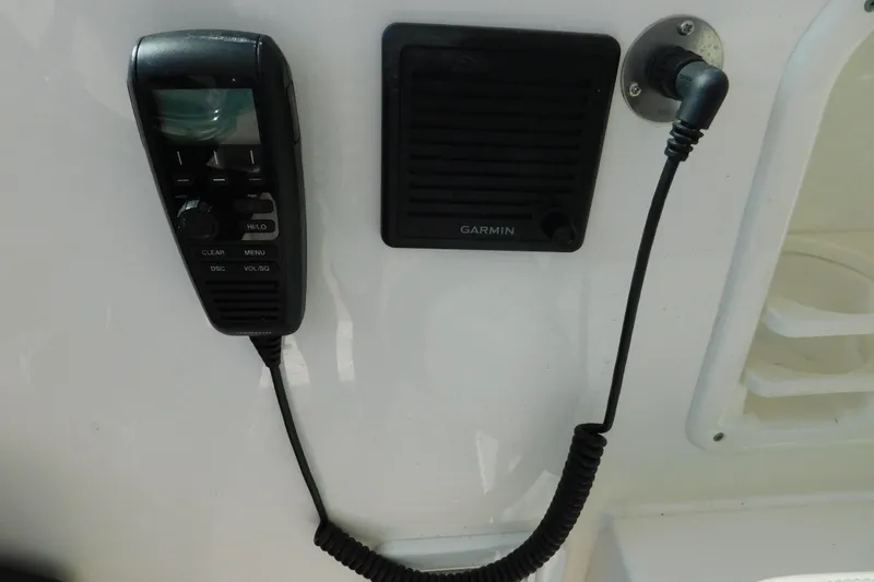 Yacht Photos Pics VHF radio and Garmin speaker on 2024 Pursuit DC 326 Dual Console boat.