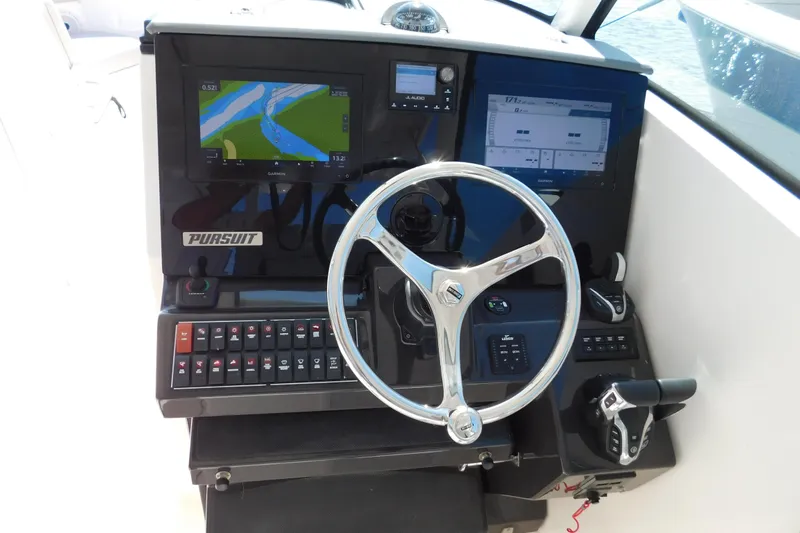  Yacht Photos Pics 2024 Pursuit DC 326 Dual Console dashboard with navigation screens and controls.