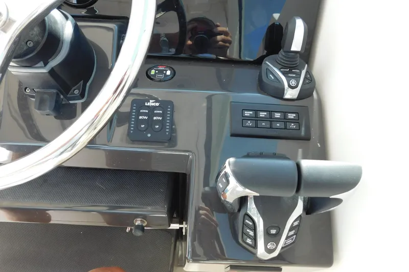  Yacht Photos Pics 2024 Pursuit DC 326 Dual Console boat dashboard with steering wheel and controls.