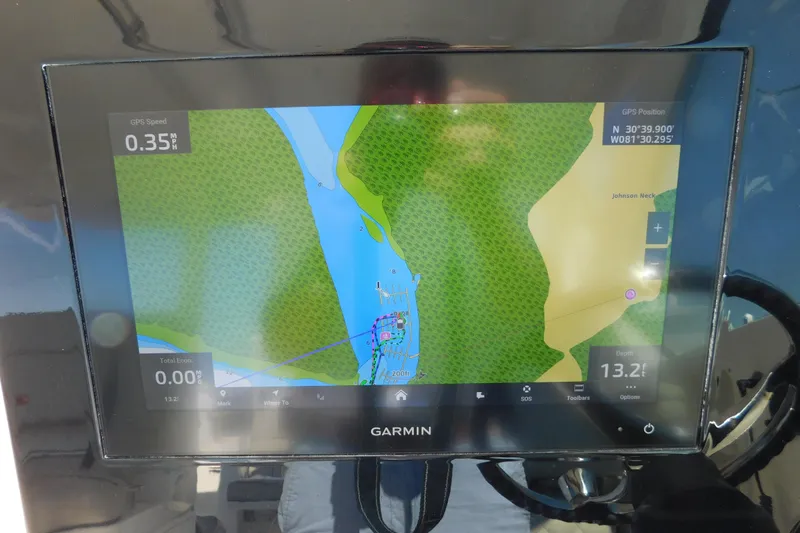  Yacht Photos Pics Garmin navigation display on 2024 Pursuit DC 326 Dual Console boat, showing map and GPS data.