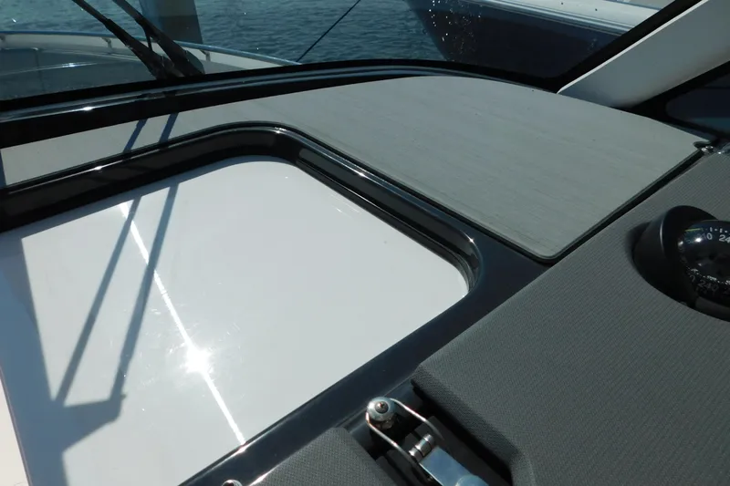  Yacht Photos Pics 2024 Pursuit DC 326 Dual Console dashboard with compass and sleek design.