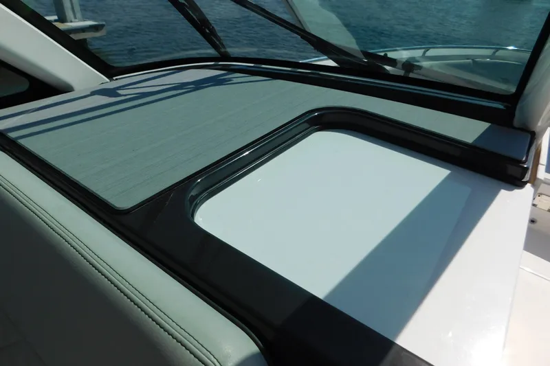  Yacht Photos Pics 2024 Pursuit DC 326 Dual Console boat dashboard with sleek design and windshield.