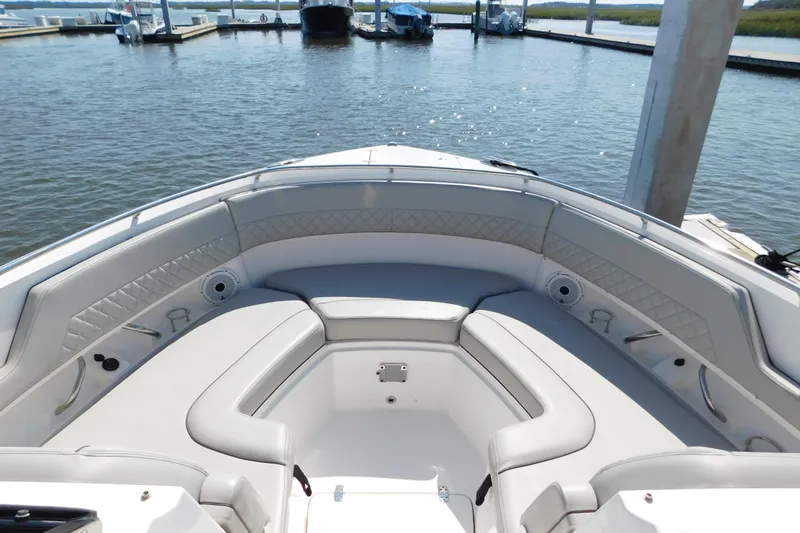  Yacht Photos Pics 2024 Pursuit DC 326 Dual Console boat interior with luxurious seating at marina.