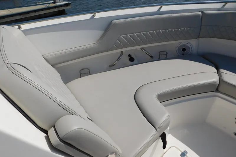  Yacht Photos Pics 2024 Pursuit DC 326 Dual Console boat interior with luxurious seating and cup holders.