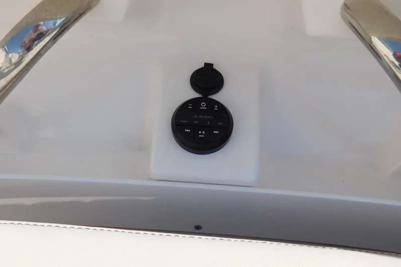  Yacht Photos Pics 2024 Pursuit DC 326 Dual Console audio control panel on boat dashboard.