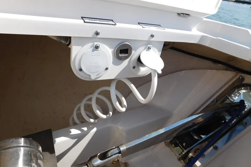  Yacht Photos Pics 2024 Pursuit DC 326 Dual Console boat washdown system with coiled hose.