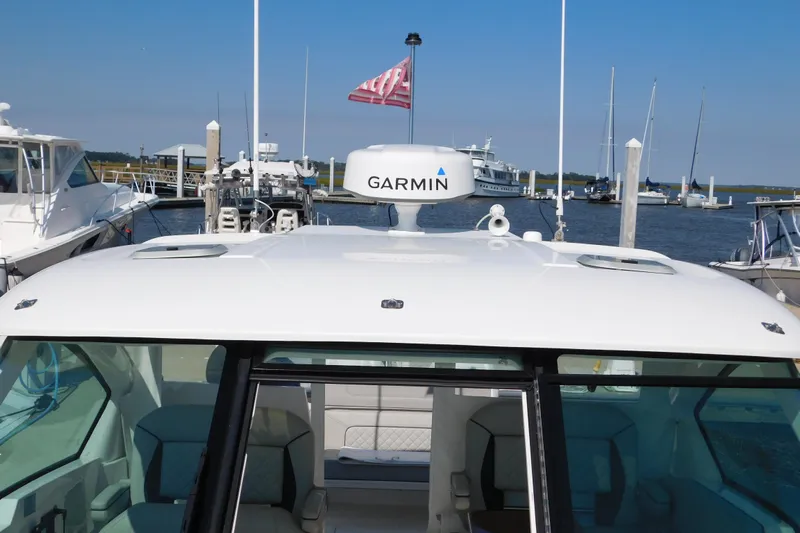  Yacht Photos Pics 2024 Pursuit DC 326 Dual Console boat with Garmin radar at marina.