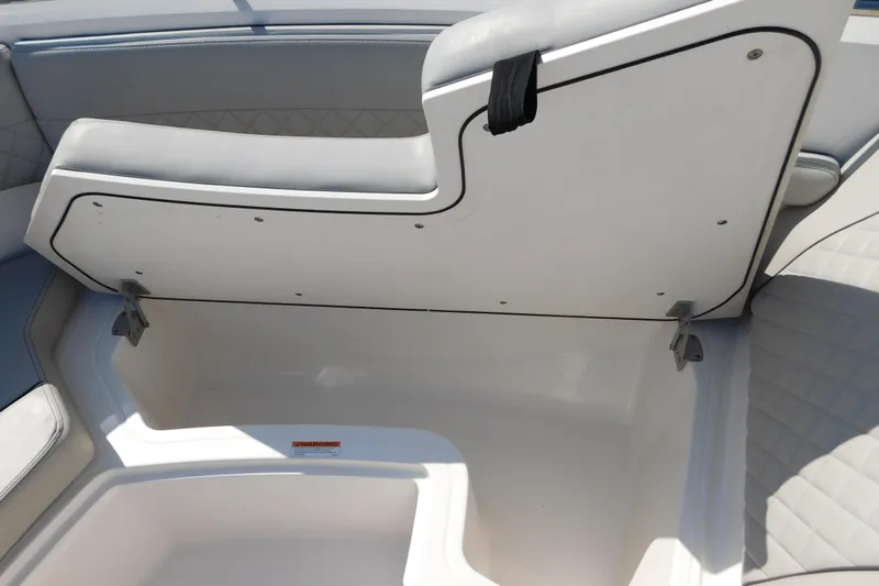  Yacht Photos Pics 2024 Pursuit DC 326 Dual Console boat storage compartment with cushioned seating.
