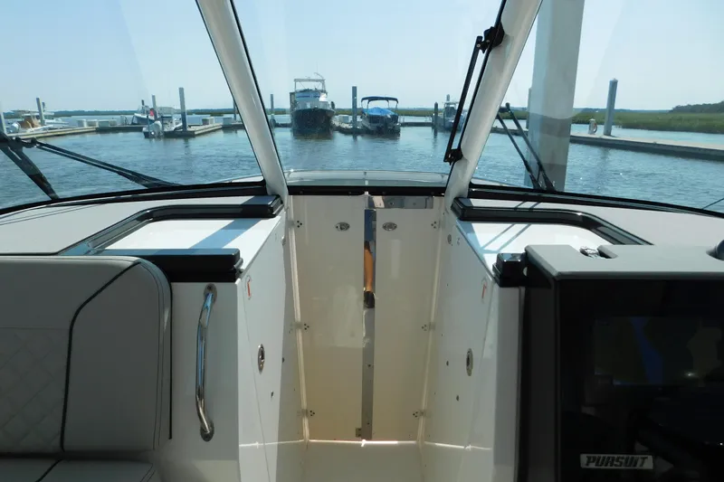  Yacht Photos Pics 2024 Pursuit DC 326 Dual Console interior view at marina dock.