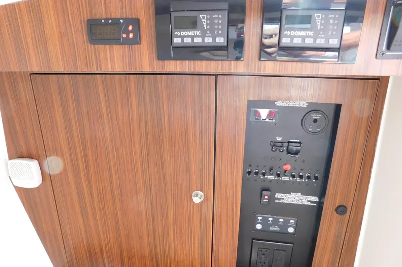  Yacht Photos Pics 2024 Pursuit DC 326 Dual Console control panel with wood finish and electronic displays.