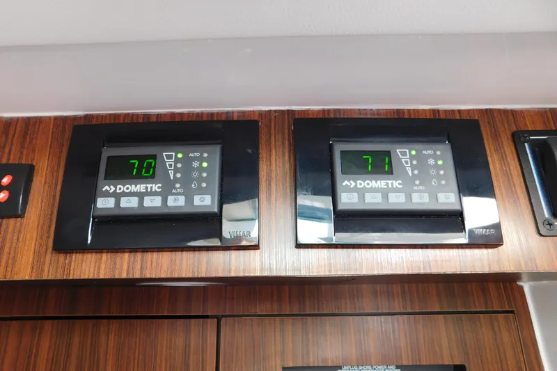  Yacht Photos Pics Dometic control panels on 2024 Pursuit DC 326 Dual Console boat, displaying temperatures 70 and 71.