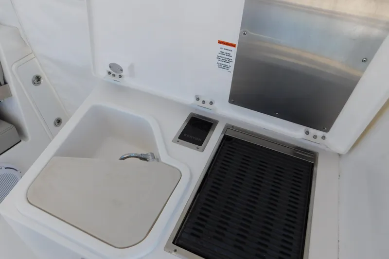  Yacht Photos Pics 2024 Pursuit DC 326 Dual Console boat sink and grill area.