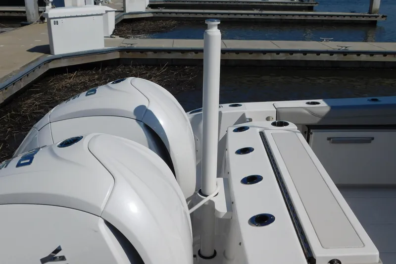  Yacht Photos Pics 2024 Pursuit DC 326 Dual Console boat with twin engines at dock.