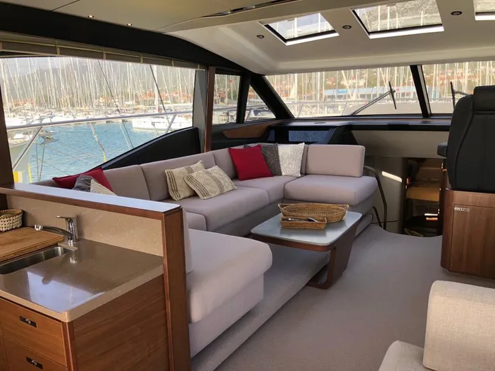  Yacht Photos Pics Luxurious interior of 2018 Princess S65 yacht with plush seating and elegant decor.