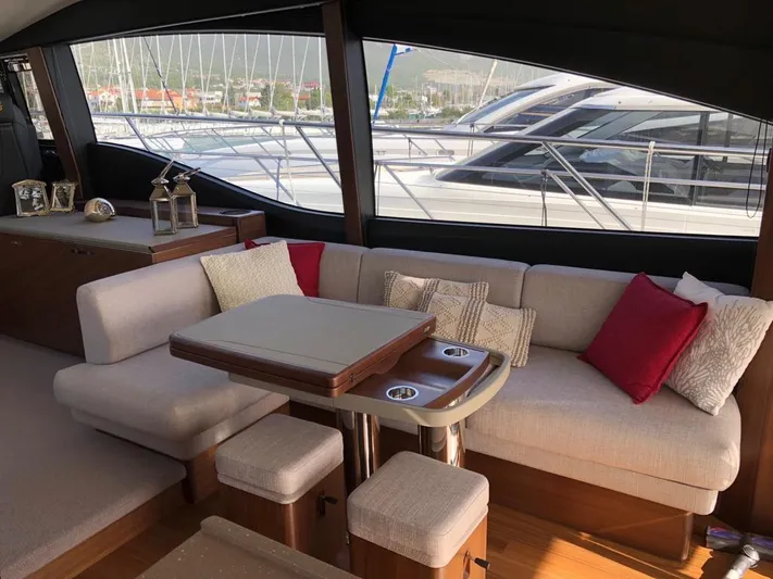  Yacht Photos Pics Luxurious interior of 2018 Princess S65 yacht with elegant seating and decor.