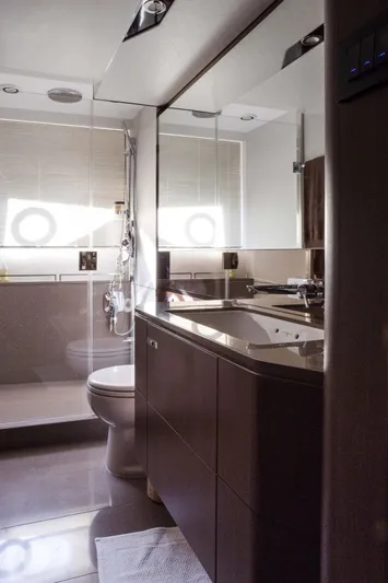  Yacht Photos Pics Luxurious bathroom in 2018 Princess S65 yacht with modern fixtures and elegant design.