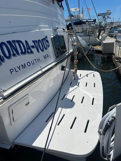 Ronda-vous Yacht Photos Pics 1990 Jefferson 42 Viscount Sundeck docked in Plymouth, MA, with visible swim platform.