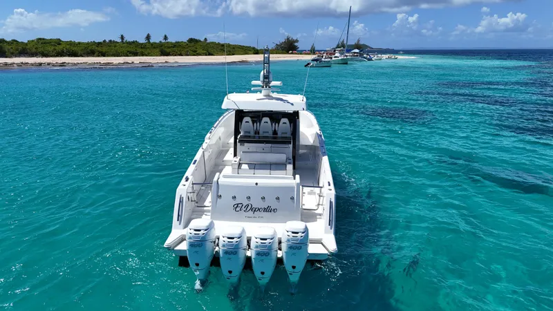  Yacht Photos Pics 2020 Ocean Alexander 45 Divergence Sport yacht in clear turquoise waters near a tropical island.