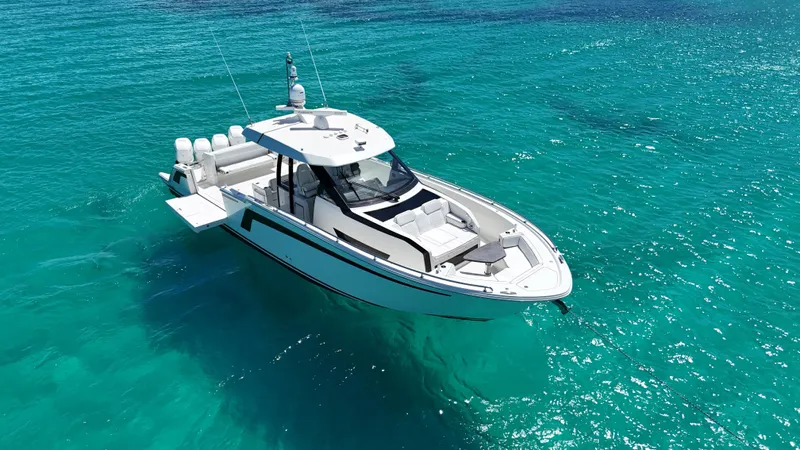  Yacht Photos Pics 2020 Ocean Alexander 45 Divergence Sport boat on clear turquoise water.