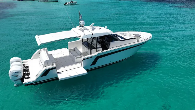  Yacht Photos Pics 2020 Ocean Alexander 45 Divergence Sport boat on clear turquoise water.