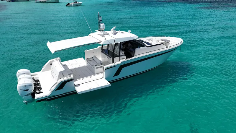  Yacht Photos Pics 2020 Ocean Alexander 45 Divergence Sport boat on clear turquoise water.