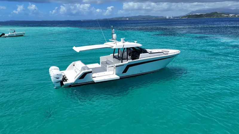  Yacht Photos Pics 2020 Ocean Alexander 45 Divergence Sport boat on clear turquoise water.