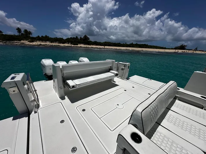  Yacht Photos Pics 2020 Ocean Alexander 45 Divergence Sport boat with spacious deck near tropical shoreline.