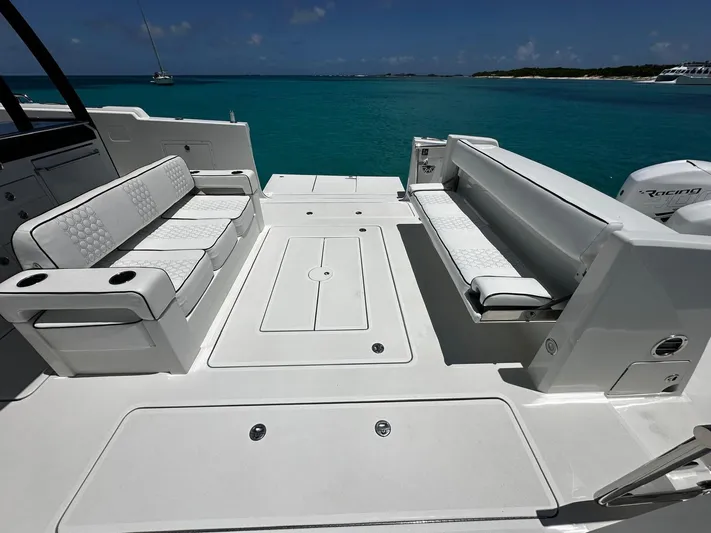  Yacht Photos Pics 2020 Ocean Alexander 45 Divergence Sport boat deck with seating, overlooking turquoise water.