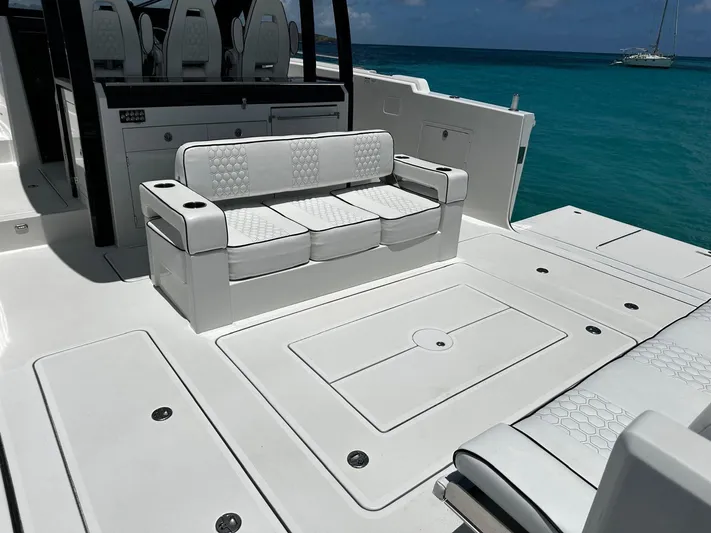  Yacht Photos Pics 2020 Ocean Alexander 45 Divergence Sport yacht with luxurious seating, docked in clear blue waters.