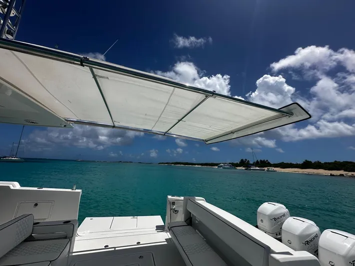  Yacht Photos Pics Ocean Alexander 45 Divergence Sport 2020, featuring a sunshade, anchored in turquoise waters.