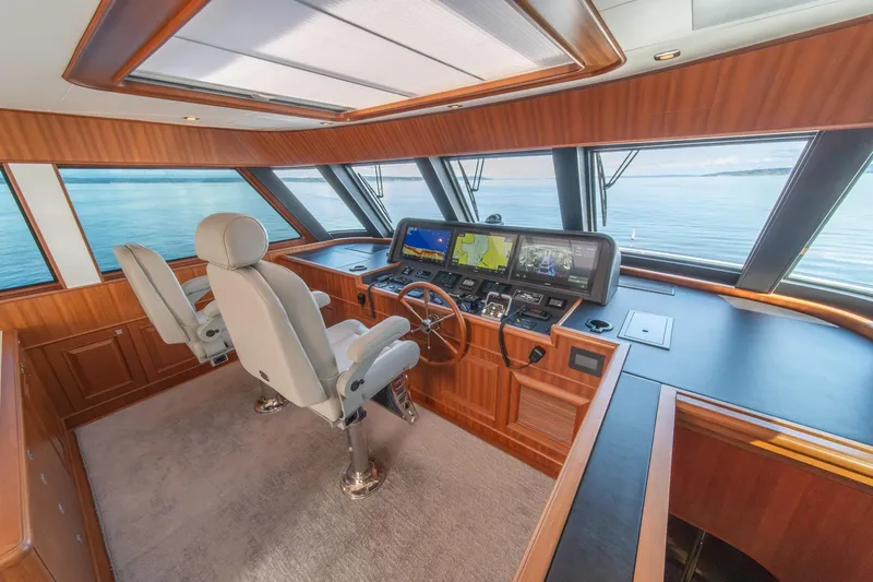 750 Skylounge Yacht Photos Pics Pilothouse interior of 2022 Hampton Endurance 750 LRC yacht with navigation equipment.