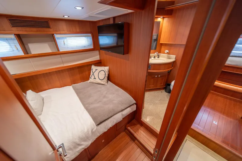 750 Skylounge Yacht Photos Pics Luxurious cabin interior of 2022 Hampton Endurance 750 LRC yacht with ensuite bathroom.