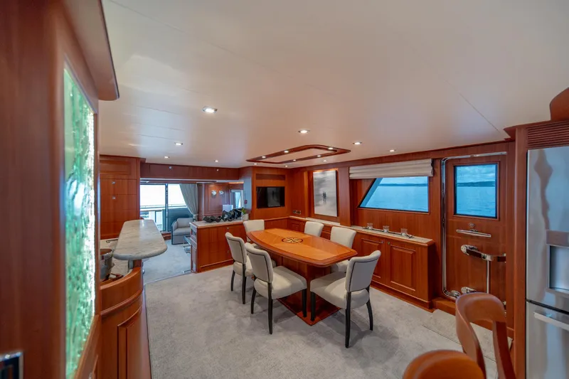 750 Skylounge Yacht Photos Pics Luxurious interior of 2022 Hampton Endurance 750 LRC yacht with elegant dining area.