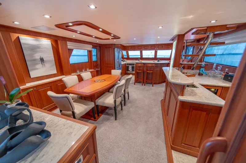 750 Skylounge Yacht Photos Pics Luxurious interior of 2022 Hampton Endurance 750 LRC yacht with elegant dining area.