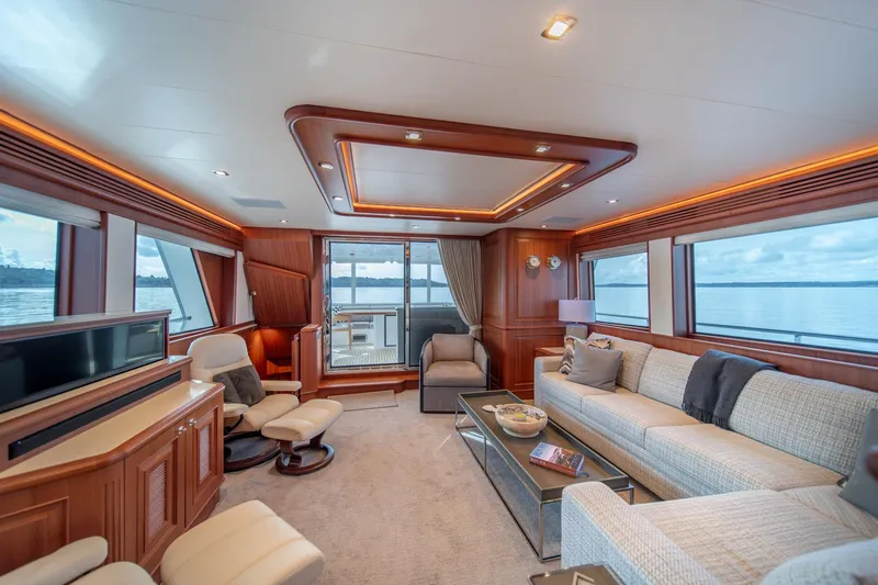 750 Skylounge Yacht Photos Pics Luxurious interior of 2022 Hampton Endurance 750 LRC yacht with elegant furnishings and panoramic windows.