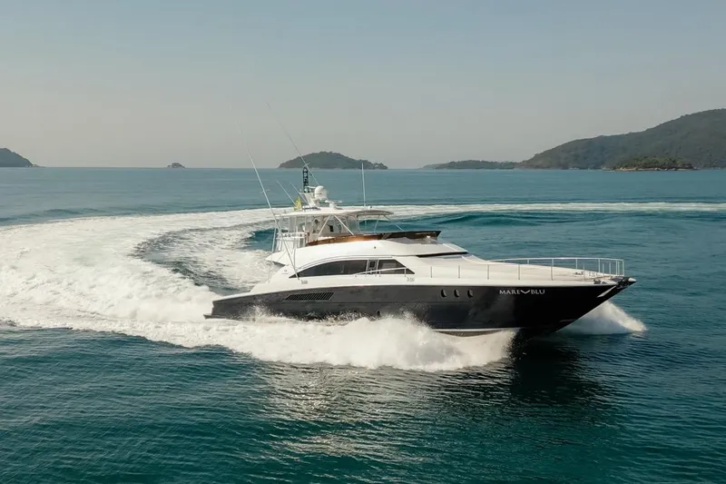 Mare Blu Yacht Photos Pics 2008 Pro Boat Yachts Power Cat 80 cruising on open water, creating a dynamic wake.