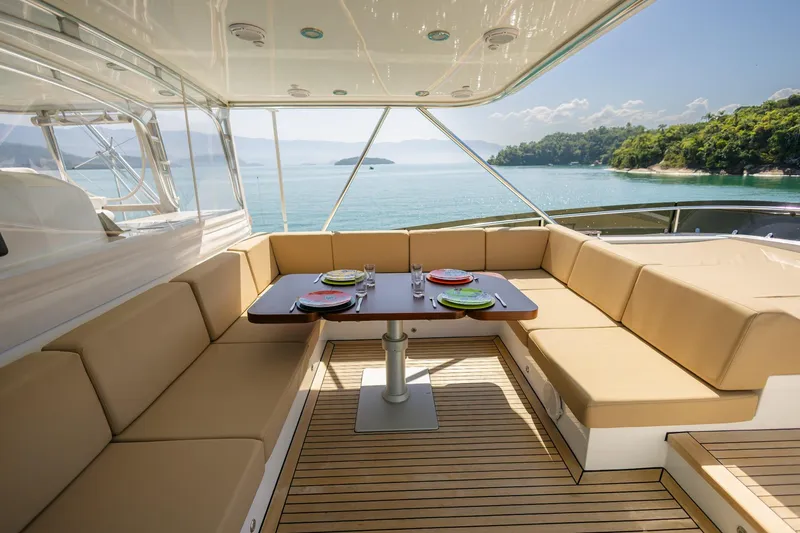 Mare Blu Yacht Photos Pics Luxurious 2008 Pro Boat Yachts Power Cat 80 with elegant outdoor seating and ocean view.