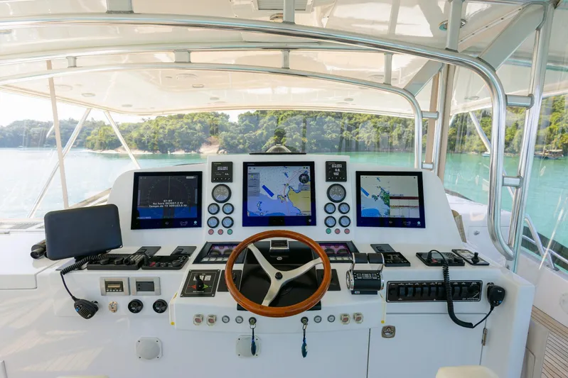 Mare Blu Yacht Photos Pics Control panel of 2008 Pro Boat Yachts Power Cat 80 with navigation screens and steering wheel.