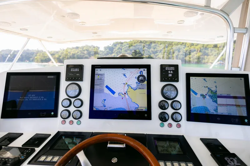 Mare Blu Yacht Photos Pics Control panel of 2008 Pro Boat Yachts Power Cat 80 with navigation screens and gauges.