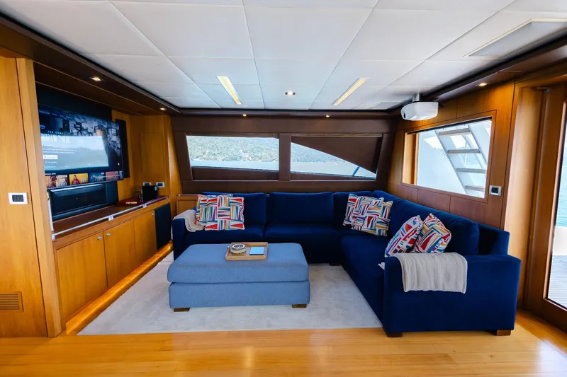 Mare Blu Yacht Photos Pics Luxurious 2008 Pro Boat Yachts Power Cat 80 interior with plush seating and entertainment system.