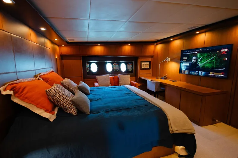 Mare Blu Yacht Photos Pics Luxurious bedroom in 2008 Pro Boat Yachts Power Cat 80 with cozy bed and large TV.