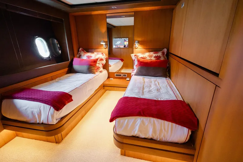 Mare Blu Yacht Photos Pics Luxurious twin cabin on 2008 Pro Boat Yachts Power Cat 80, featuring elegant decor.