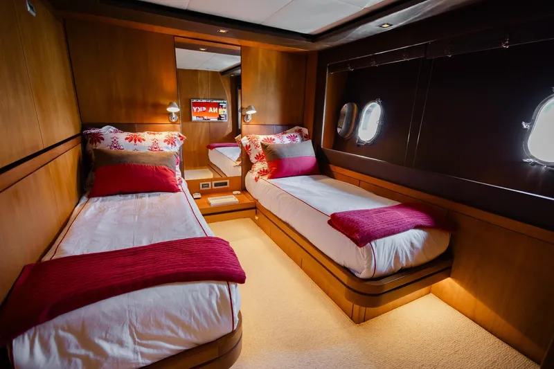 Mare Blu Yacht Photos Pics Luxurious twin cabin in 2008 Pro Boat Yachts Power Cat 80, featuring elegant wood paneling.