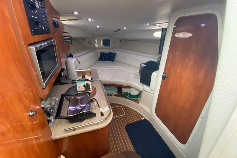  Yacht Photos Pics Interior of 2014 Wellcraft 340 Coastal boat with kitchenette and seating area.