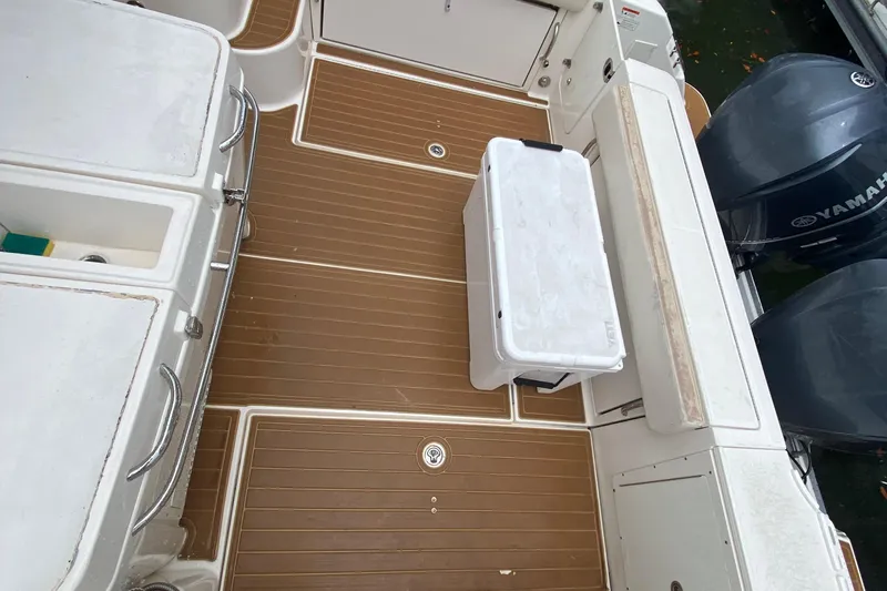  Yacht Photos Pics 2014 Wellcraft 340 Coastal boat deck with Yamaha engines and storage compartments.