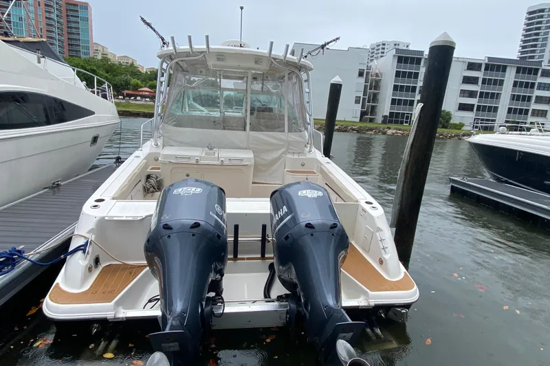  Yacht Photos Pics 2014 Wellcraft 340 Coastal boat docked with twin Yamaha engines.